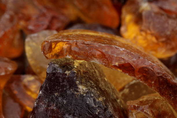 istock Pieces of amber as background, closeup view 1317612486
