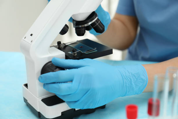 Doctor with blood sample from finger at table in laboratory, closeup Doctor with blood sample from finger at table in laboratory, closeup diabetes epidemiology stock pictures, royalty-free photos & images