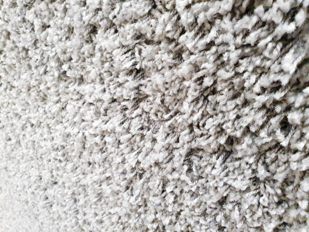 istock Gray long pile carpet texture background. Polypropylene long pile carpet, close-up 1317612768