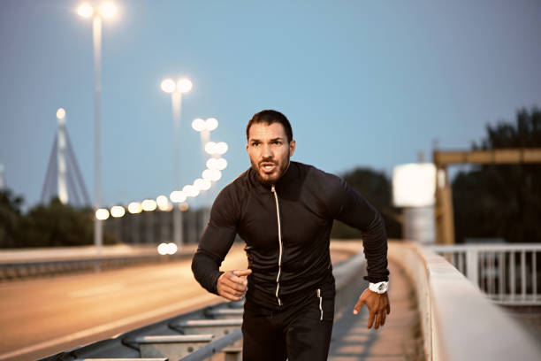 istock A young male athlete, preparing for training at dusk. 1317612774