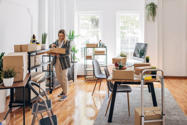 istock Woman packing customers orders 1317612783
