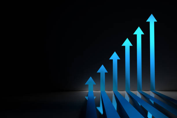 istock Blue glowing arrows pointing up on black background 1317612809