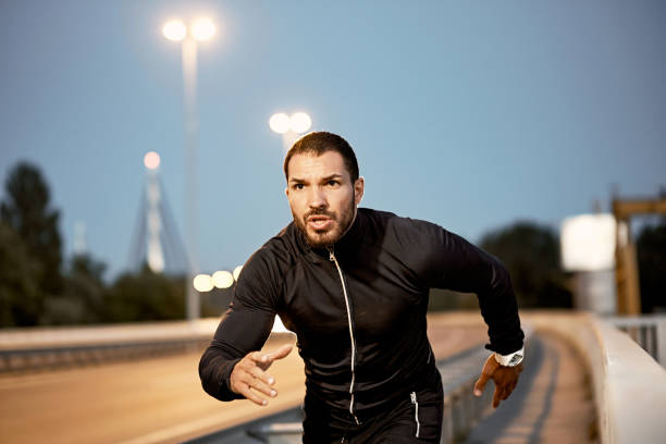 istock A young male athlete, preparing for training at dusk. 1317613927