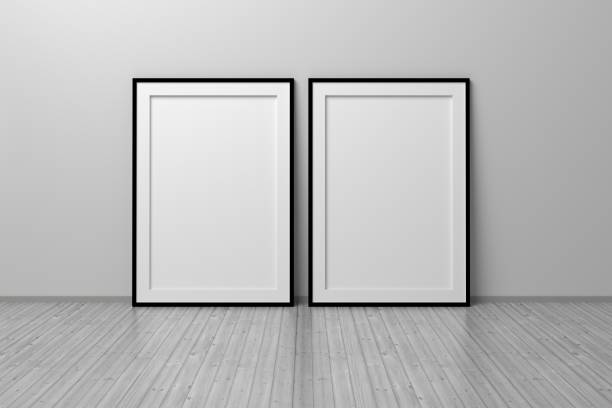 istock Two A4 blank vertical frames standing on wooden reflective floor 1317614282
