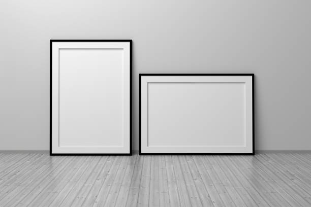 istock Two A4 blank empty frames vertical and horizontal standing on wooden floor i 1317614401