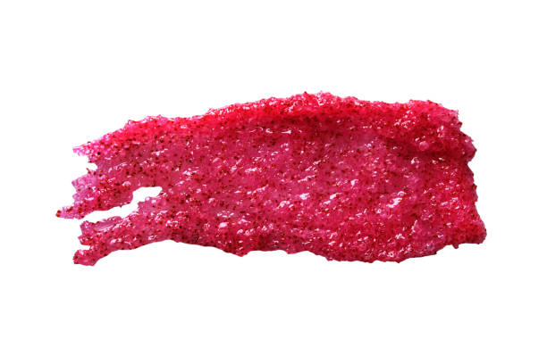 istock Smear of Exfoliating Scrub with berry and sugar. Close-up, isolate on white 1317614482