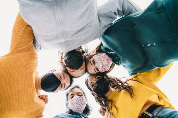 istock Millennial friends are looking down together - View from below 1317614859