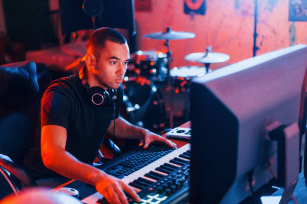 istock Sound engineer working and mixing music indoors in the studio 1317616064