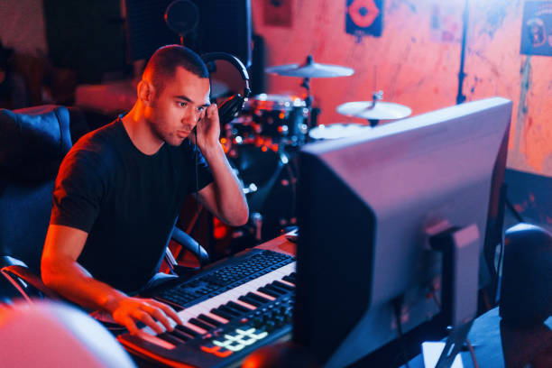 istock Sound engineer working and mixing music indoors in the studio 1317616080