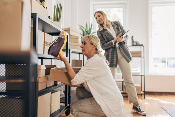 istock Women arranging customers orders in storage room 1317616172