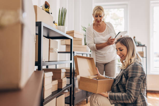 istock Women arranging customers orders in storage room 1317616258