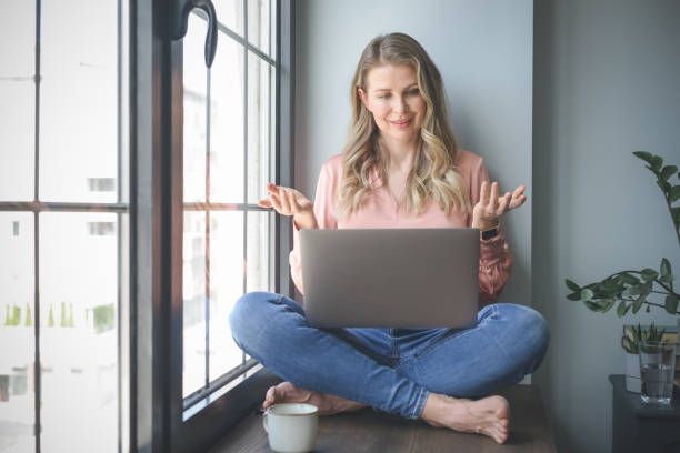 istock attractive middle aged woman working in the office ( Video Conference) 1317619023