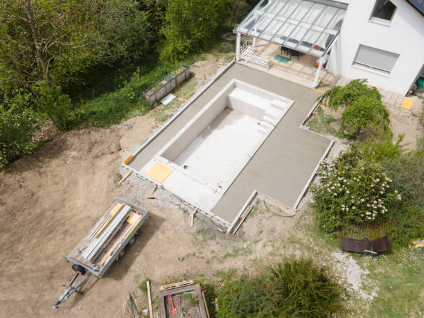 istock aerial drone flight pic of Swimming pool construction site from above 1317619287