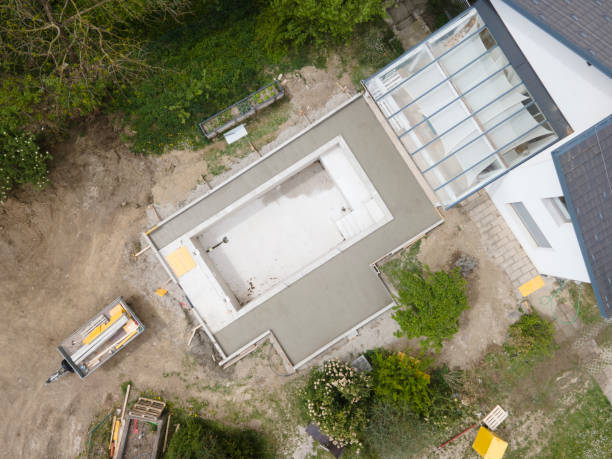 istock aerial drone flight pic of Swimming pool construction site from above 1317619288