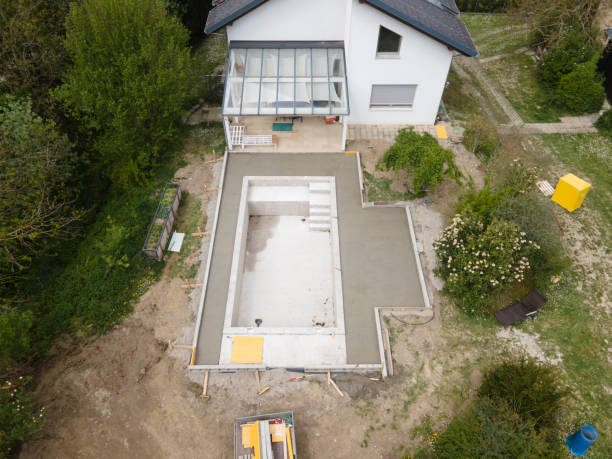 istock aerial drone flight pic of Swimming pool construction site from above 1317619365