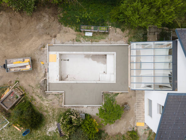 istock aerial drone flight pic of Swimming pool construction site from above 1317619379