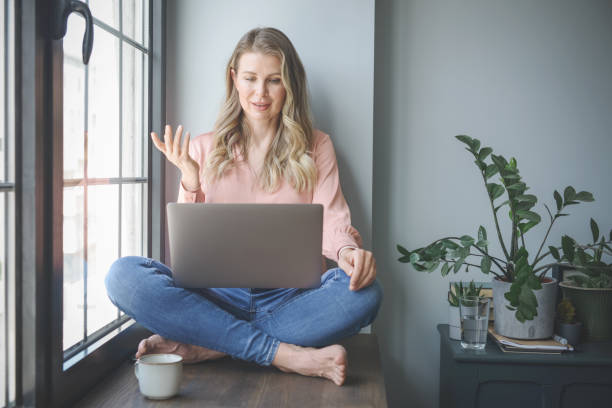 istock attractive middle aged woman working in the office ( Video Conference) 1317619551