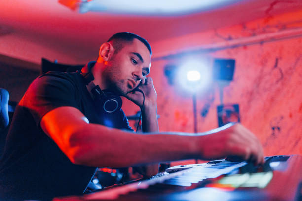 istock Professional sound engineer working and mixing music indoors in the studio 1317619651