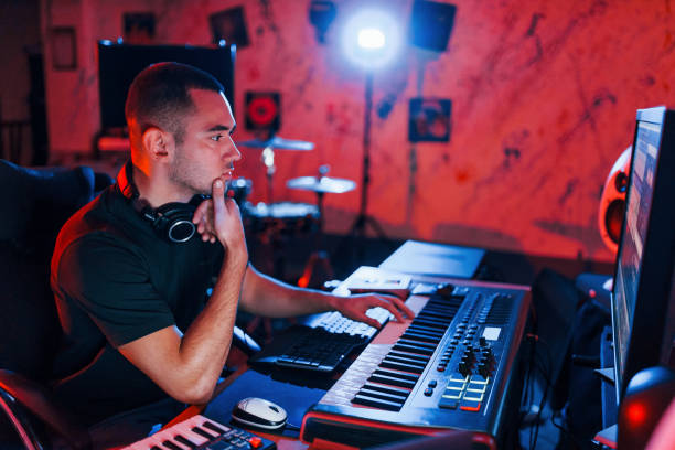 istock Professional sound engineer working and mixing music indoors in the studio 1317619753
