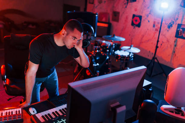 istock Professional sound engineer working and mixing music indoors in the studio 1317619762