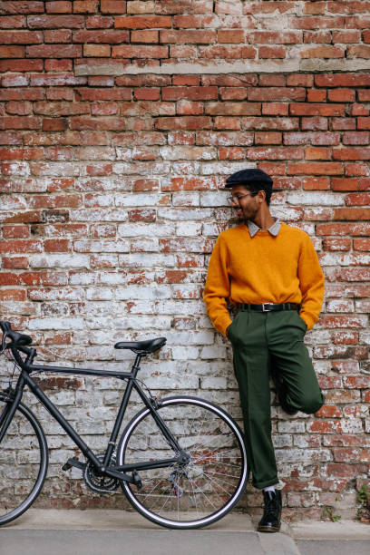 istock Handsome man resting beside his bike 1317619809