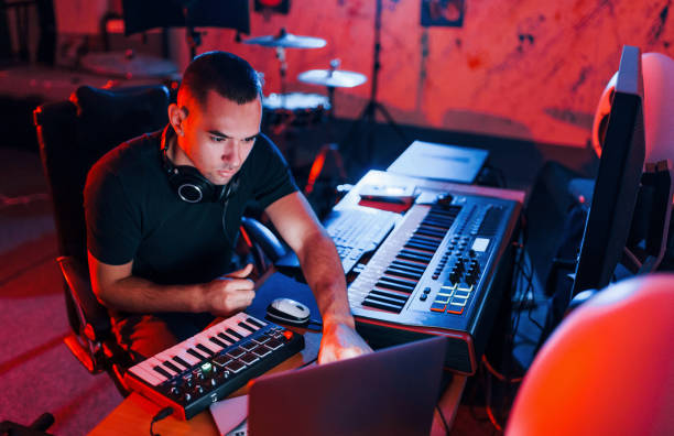 istock Professional sound engineer working and mixing music indoors in the studio 1317619867