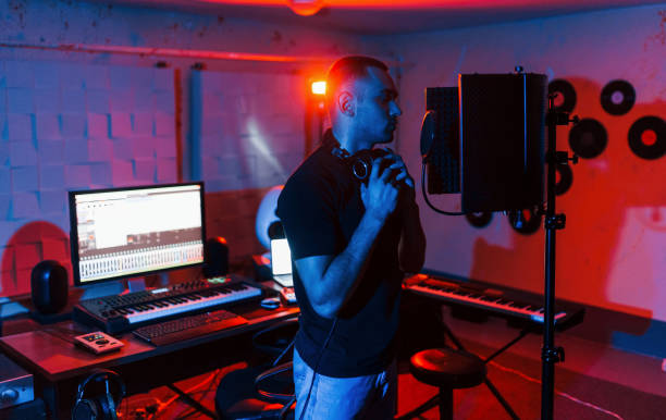 istock Vocalist have recording session indoors in the modern professional studio 1317620964