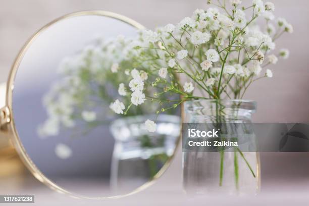 Rustic Babyu2019s Breath Dried White Gypsophila Flowers And Mirror On The Table Beautiful Wedding Decor Ideas And Decor Interior Stock Photo - Download Image Now