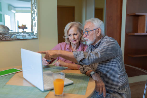 istock Romantic Senior Couple Likes Online Shopping. 1317622023