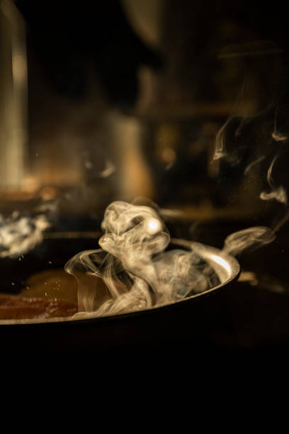 istock Fish fillet fries in the pan while steaming 1317622383