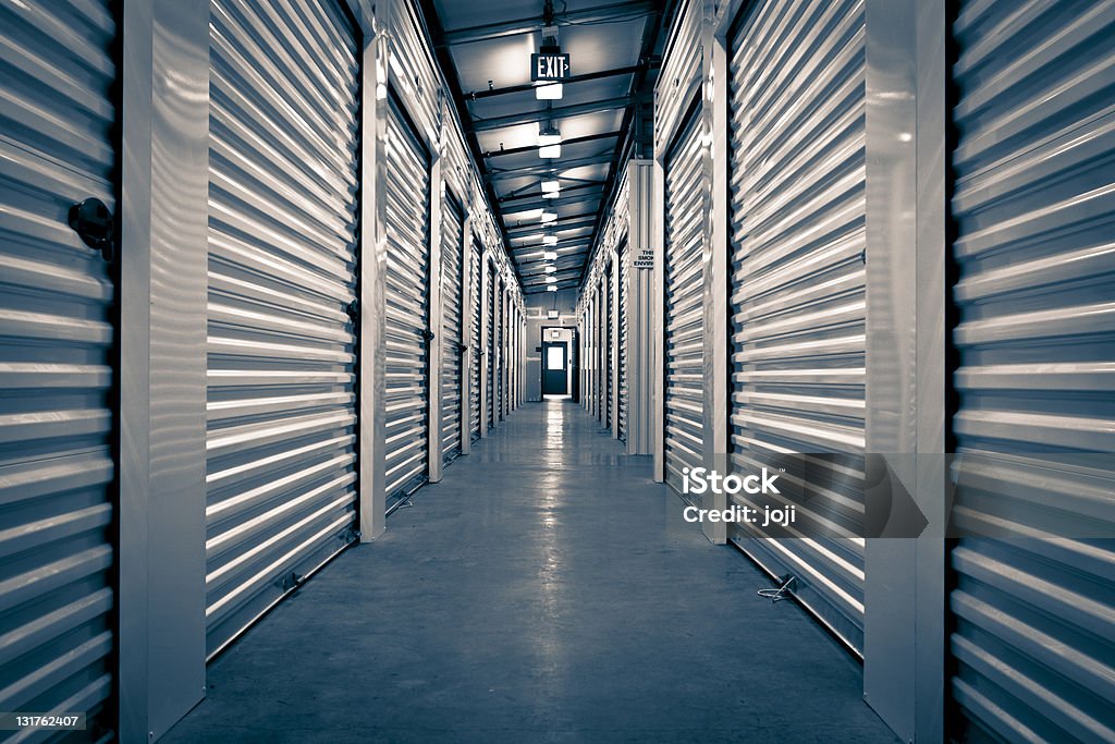 Hallway of Storage Facility A vanishing point perspective of a Storage Facility. Storage Compartment Stock Photo