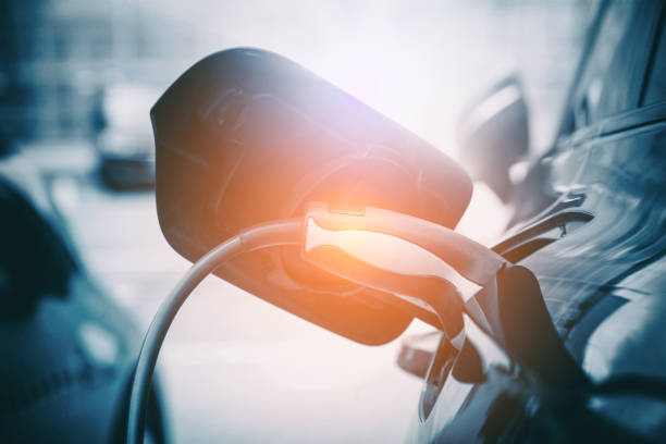 istock Electric Car Charging At Power Station 1317624214