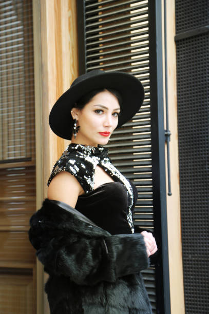 istock pretty young woman in fur coat and hat 1317625521