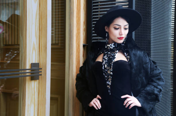 istock pretty young woman in fur coat and hat 1317625574