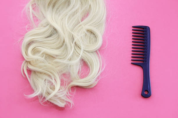 istock a lock of white hair and a comb 1317626867