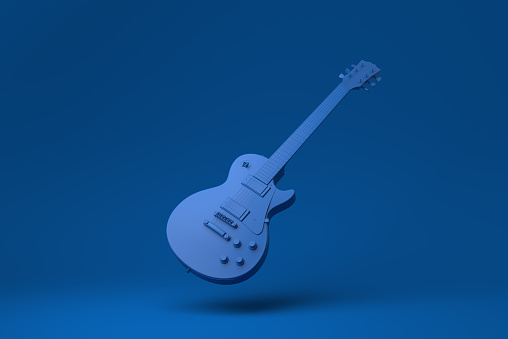 Blue Electric guitar floating in blue background. minimal concept idea creative. monochrome. 3D render.