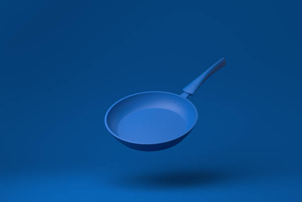 istock Blue Flying pan floating in blue background. minimal concept idea creative. monochrome. 3D render. 1317627339