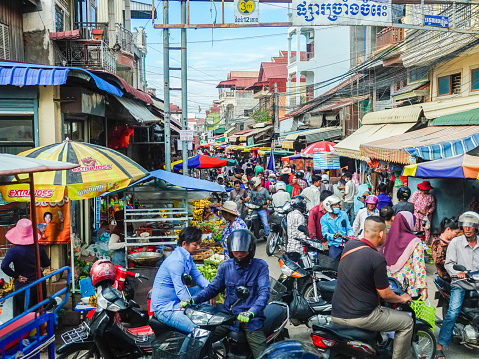 Phnom Penh, Cambodia- September 4, 2018: Very busy and crowded local market street on the outskirts of Phnom Penh, Cambodia.