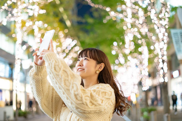 istock young woman watching the illumination at night 1317628337
