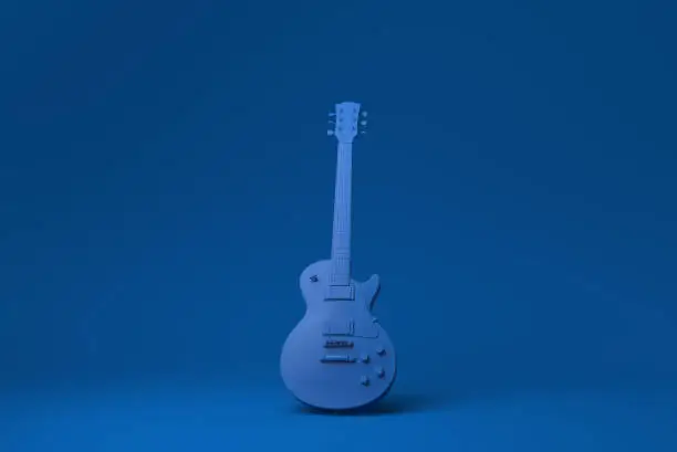 Photo of Blue Electric guitar in blue background. minimal concept idea creative. monochrome. 3D render.