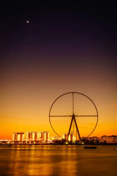 Twilight view of Bluewaters Island and Ain Dubai during construction, Dubai, UAE