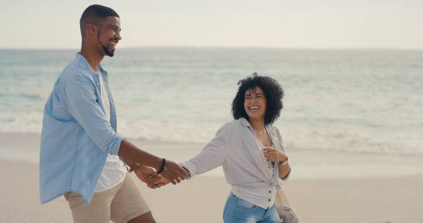 istock Shot of an affectionate couple walking on the beach 1317632762