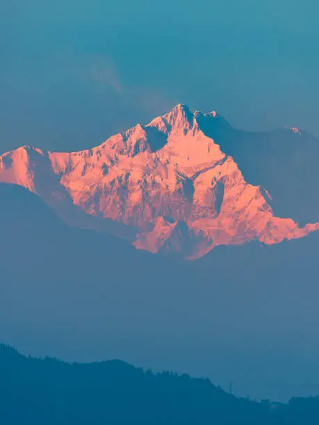 Snow Cladding kanchenjunga with valley at the time of Sunrise.