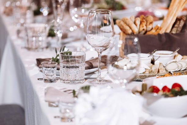 istock Flower table decorations for holidays and wedding dinner. Table set for holiday, event, party or wedding reception in a restaurant. 1317635539