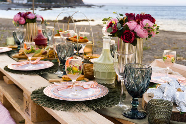 istock Picnic table on the beach with assorted food 1317637048