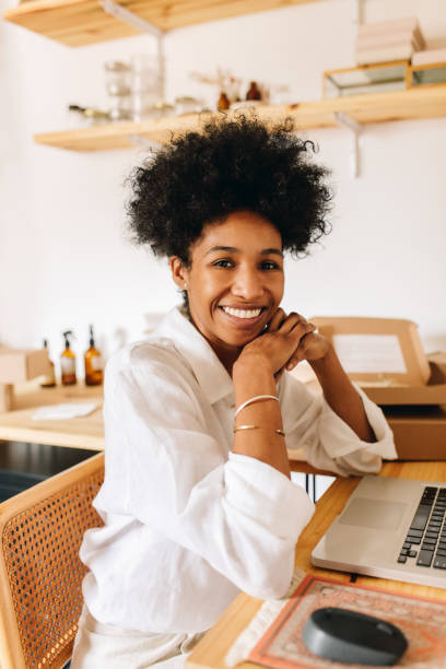 istock Cheerful e-commerce business owner sitting in office 1317637707