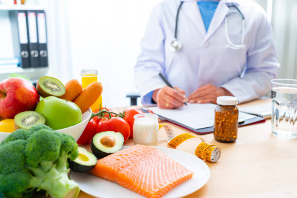 istock Nutritionist at office writing a diet plan 1317638340