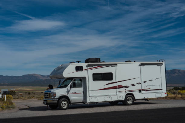 istock C-type camper with slideouts standing in the desert with mountains in the background 1317638357