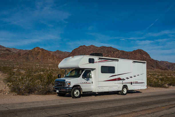 istock C-type camper with slideouts standing in the desert with mountains in the background 1317638379