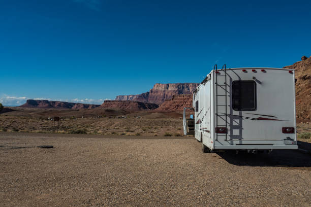 istock C-type camper with slideouts standing in the desert with mountains in the background 1317638399